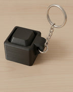 Mini Key Clicker Keychain on a silver chain keyring