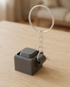 Mini Key Clicker Keychain on a silver chain keyring