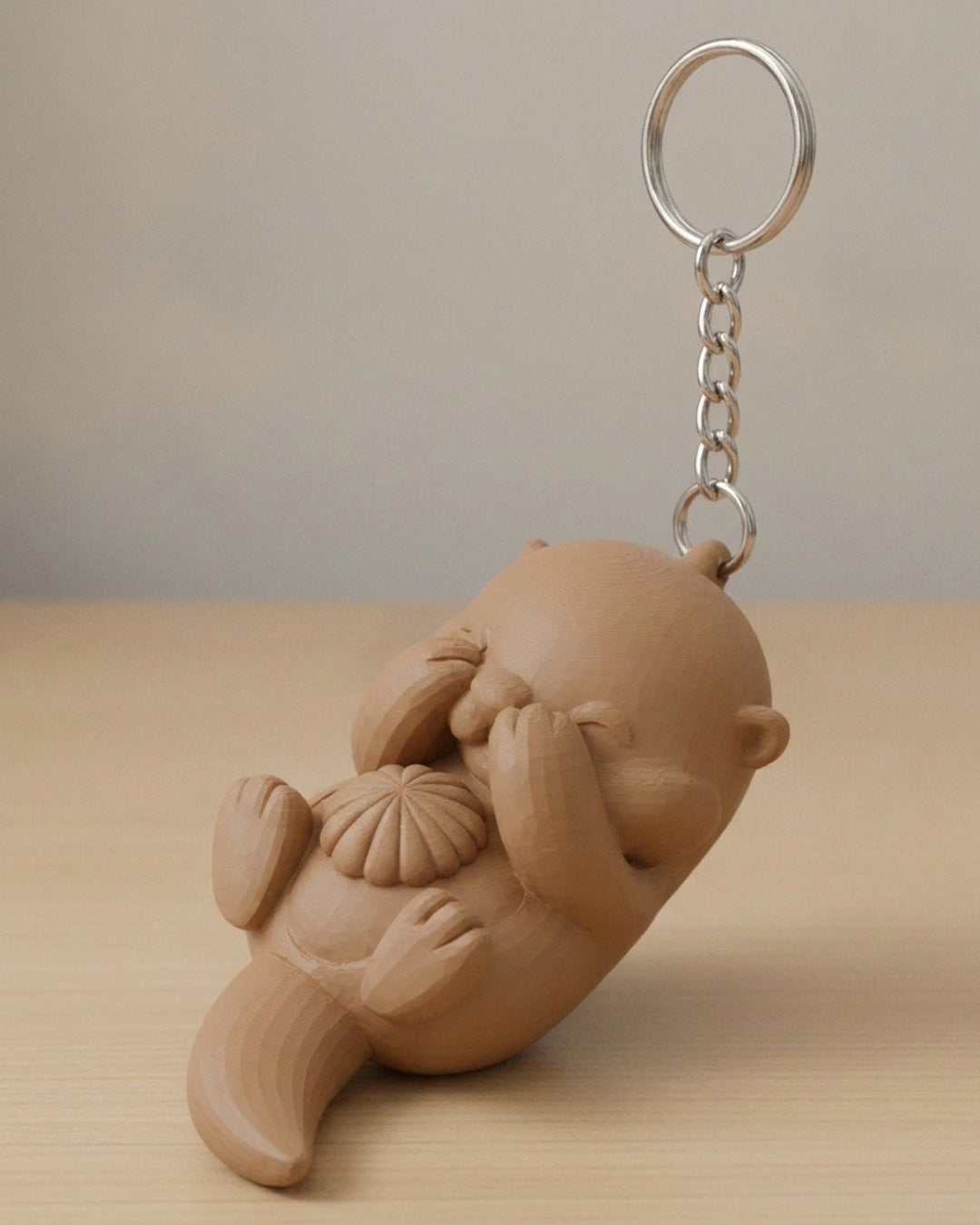Otter Clicker on a silver chain keyring