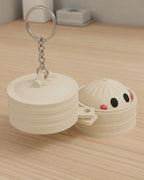 Dumpling Clicker Keychain on a silver chain keyring