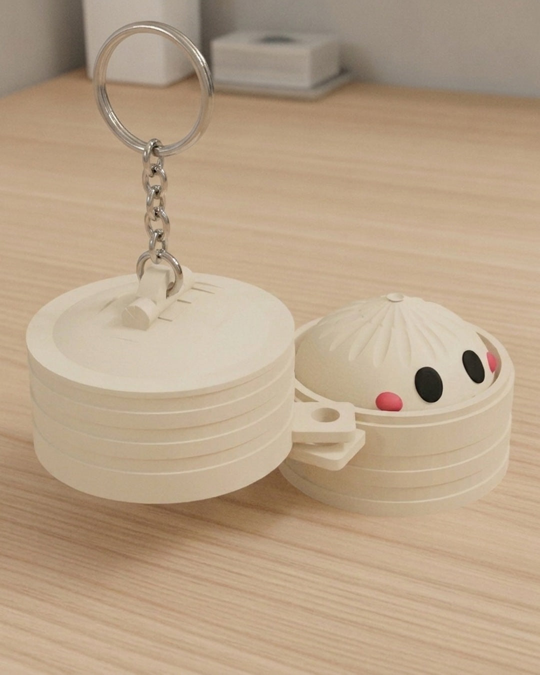 Dumpling Clicker Keychain on a silver chain keyring