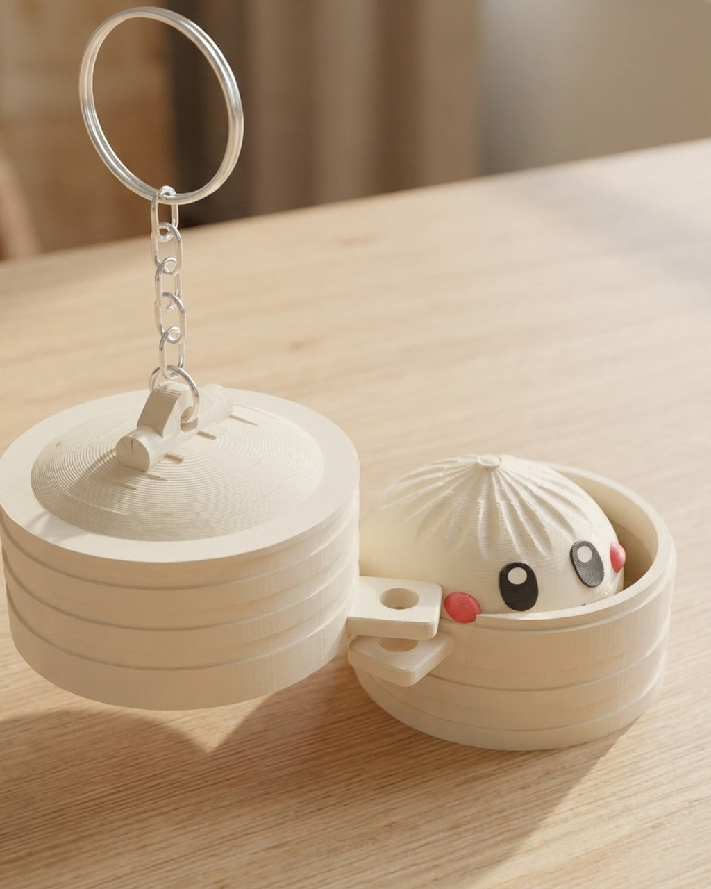 Dumpling Clicker Keychain on a silver chain keyring