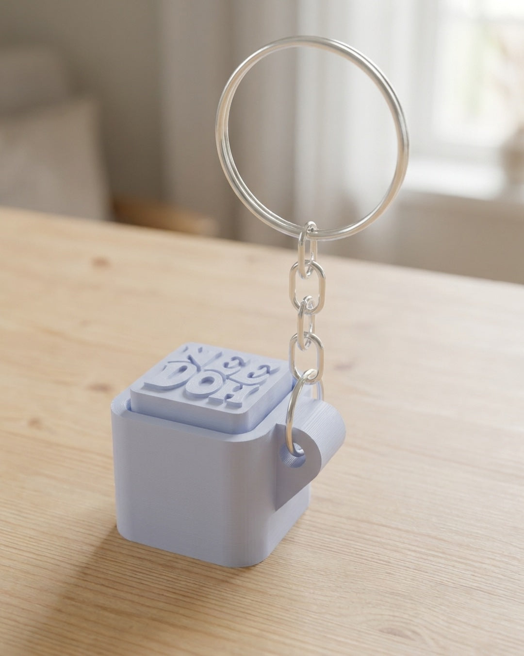 Cube Keycap Clicker Keychain on a silver chain keyring
