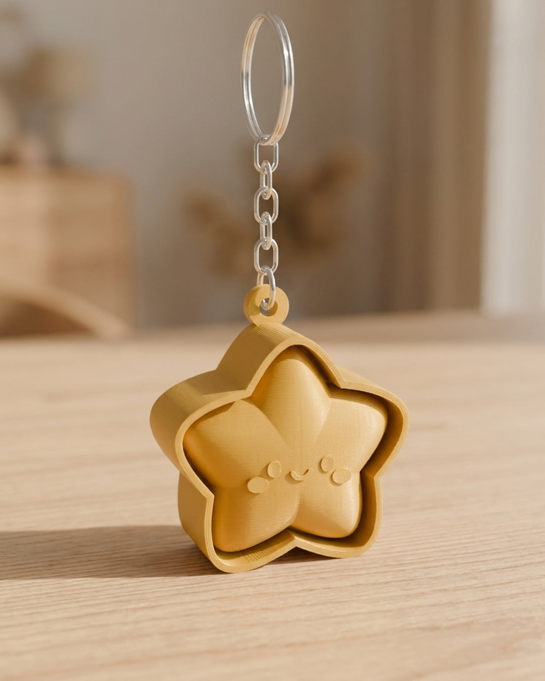 Star Face Clicker Keychain on a silver chain keyring